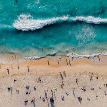 A scenic aerial view of Perth, Western Australia, showcasing the city's skyline, Swan River, and lush greenery. The image highlights Perth’s vibrant urban landscape and natural beauty.
